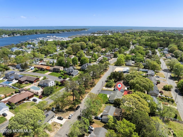 aerial view of residential area with a large body of water