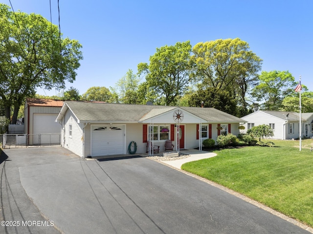 single story home featuring an attached garage and asphalt driveway