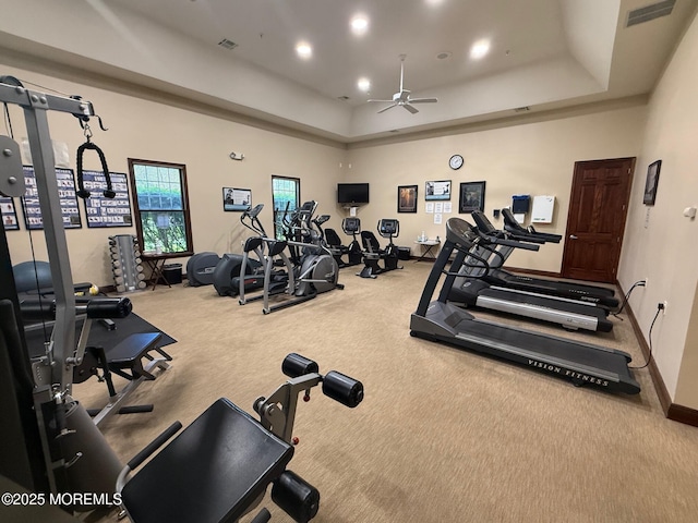 workout area with carpet, ceiling fan, recessed lighting, a raised ceiling, and baseboards
