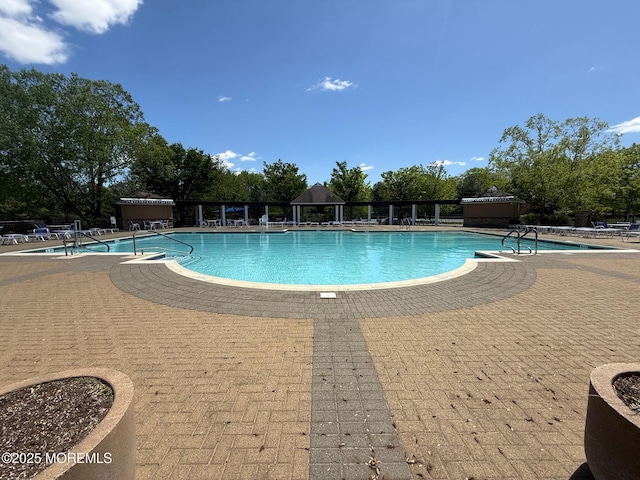 community pool featuring a patio area