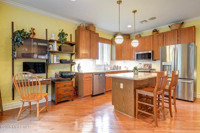 kitchen with stainless steel appliances, open shelves, a center island, ornamental molding, and backsplash