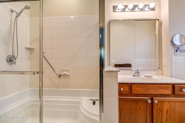 full bath with a stall shower and vanity
