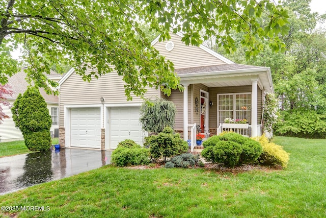 view of front of property with covered porch, a garage, concrete driveway, a front lawn, and stone siding
