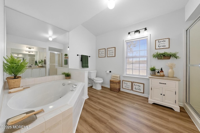 316 Nautilus Dr, Manahawkin, NJ 08050 - bathroom with a shower stall, toilet, a garden tub, wood finished floors, and baseboards