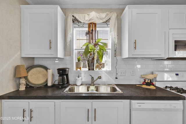 16 Bayshore Mobile Mnr, Hazlet, NJ 07730 - kitchen featuring a sink, white appliances, dark countertops, and white cabinetry
