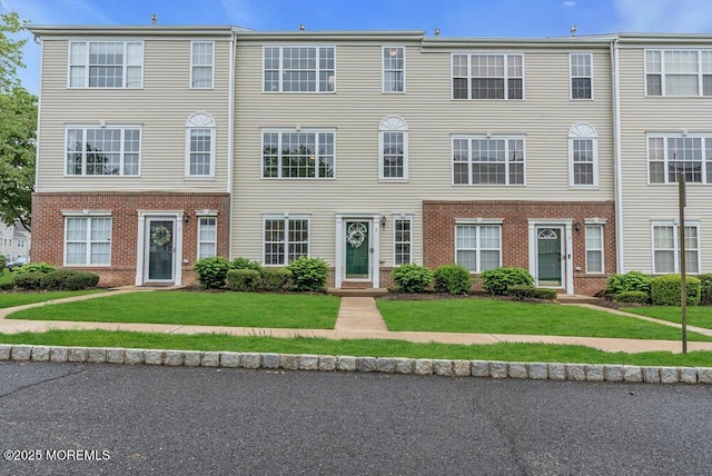 3 Kuczynski Dr Unit 944, Parlin, NJ 08859 - townhome / multi-family property featuring brick siding and a front lawn