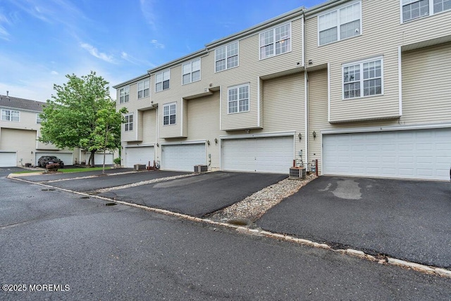 3 Kuczynski Dr Unit 944, Parlin, NJ 08859 - view of front of home featuring driveway, a garage, and central AC unit