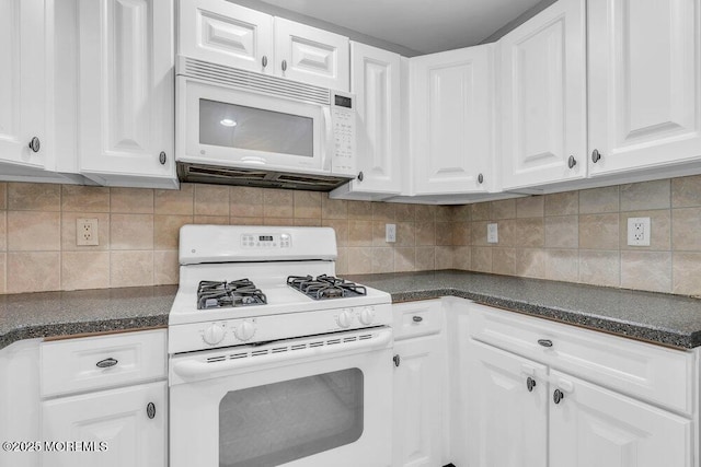 3 Kuczynski Dr Unit 944, Parlin, NJ 08859 - kitchen featuring white appliances, dark countertops, white cabinetry, and decorative backsplash