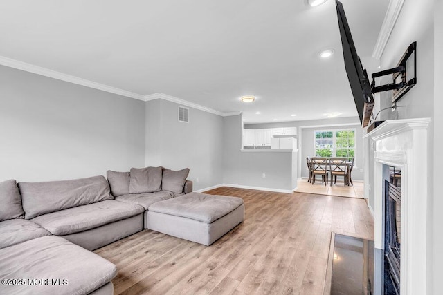 3 Kuczynski Dr Unit 944, Parlin, NJ 08859 - living room with light wood finished floors, ornamental molding, a fireplace, baseboards, and recessed lighting