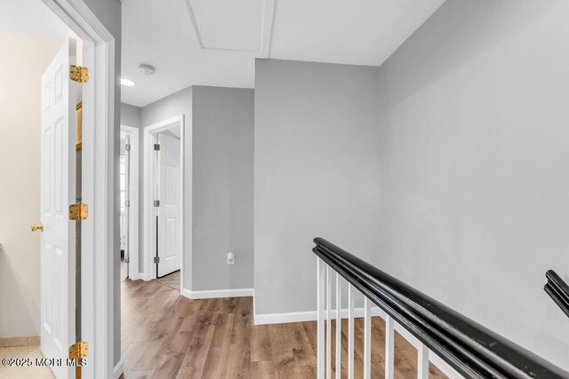 3 Kuczynski Dr Unit 944, Parlin, NJ 08859 - corridor with baseboards, wood finished floors, and an upstairs landing