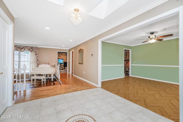 dining room featuring baseboards, recessed lighting, a skylight, crown molding, and a chandelier
