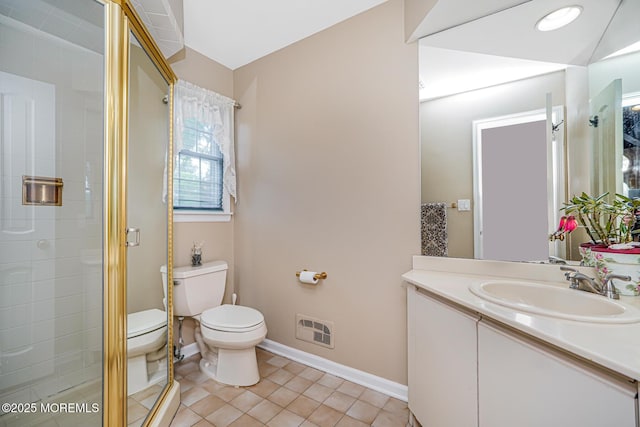 full bath with toilet, a stall shower, tile patterned flooring, vanity, and baseboards