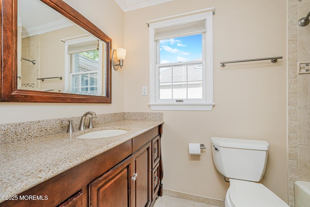 bathroom with crown molding, toilet, vanity, baseboards, and tile patterned flooring