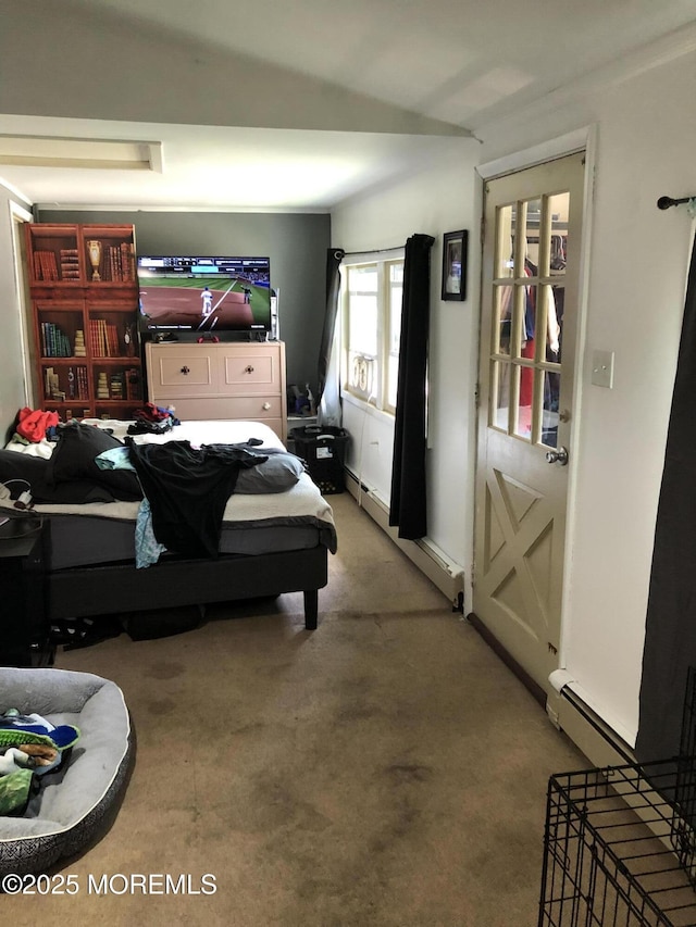 bedroom featuring light carpet and a baseboard heating unit