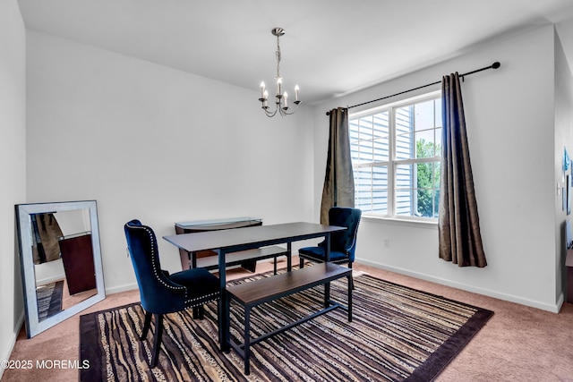 dining space with a chandelier, carpet flooring, baseboards, and an office area