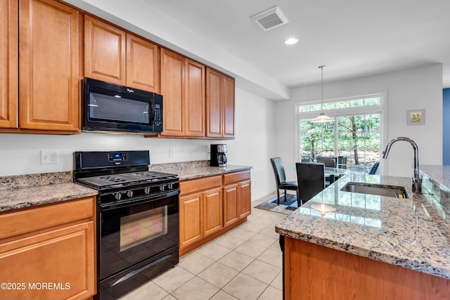 kitchen with black appliances, a sink, recessed lighting, light stone counters, and light tile patterned floors