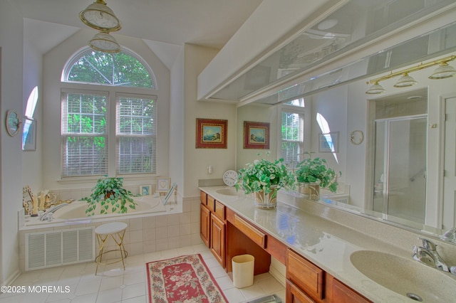 10 Lakeland Dr, Barnegat, NJ 08005 - bathroom featuring healthy amount of natural light, tile patterned floors, double vanity, a garden tub, and lofted ceiling