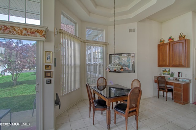 10 Lakeland Dr, Barnegat, NJ 08005 - dining room with a towering ceiling, light tile patterned flooring, a tray ceiling, and a desk