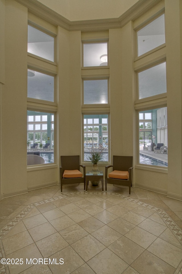 10 Lakeland Dr, Barnegat, NJ 08005 - living area with a high ceiling, inlaid floor details, tile patterned floors, and baseboards