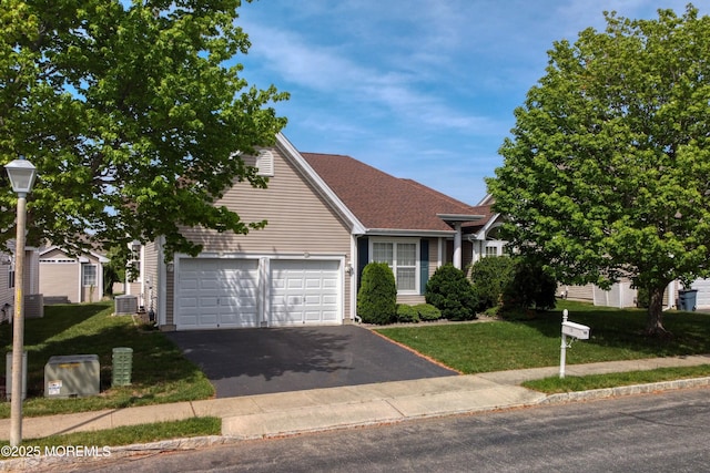 10 Lakeland Dr, Barnegat, NJ 08005 - view of front of house with driveway, a garage, a front lawn, and cooling unit