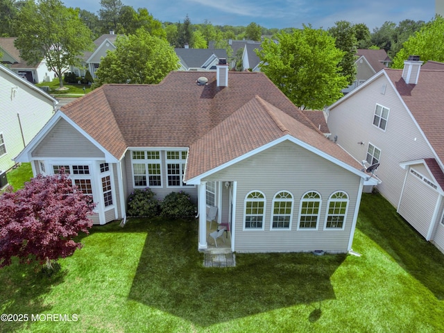 10 Lakeland Dr, Barnegat, NJ 08005 - back of property with a shingled roof, a lawn, and a chimney