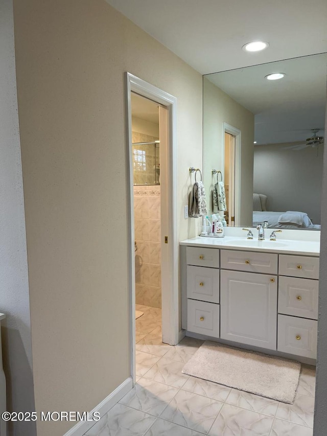 9 Darien Dr, West Long Branch, NJ 07764 - ensuite bathroom with marble finish flooring, a tile shower, vanity, recessed lighting, and baseboards