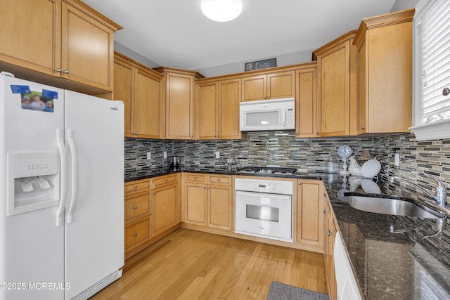 2210 Xanadu Ln, Wall, NJ 07719 - kitchen featuring white appliances, a sink, light wood-style flooring, and decorative backsplash