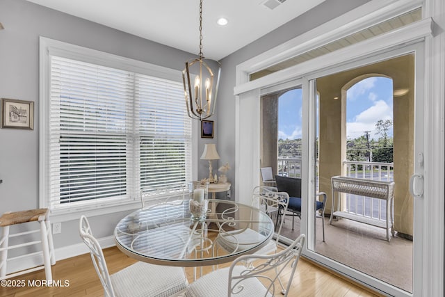 2210 Xanadu Ln, Wall, NJ 07719 - dining area with wood finished floors, a chandelier, baseboards, and recessed lighting