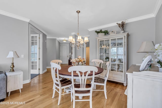 2210 Xanadu Ln, Wall, NJ 07719 - dining room with a chandelier, ornamental molding, light wood-style floors, and baseboards