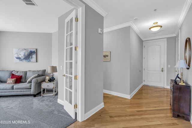 2210 Xanadu Ln, Wall, NJ 07719 - entryway with light wood finished floors, baseboards, and crown molding
