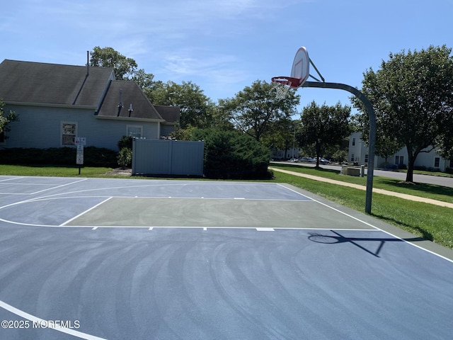 view of sport court with community basketball court and a yard