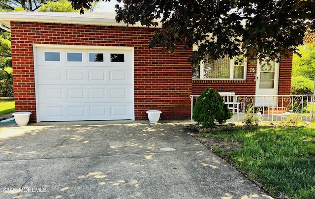 garage with concrete driveway
