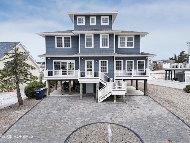 4 E Pimlico Rd, Little Egg Harbor, NJ 08087 - back of property featuring a carport, driveway, and roof with shingles