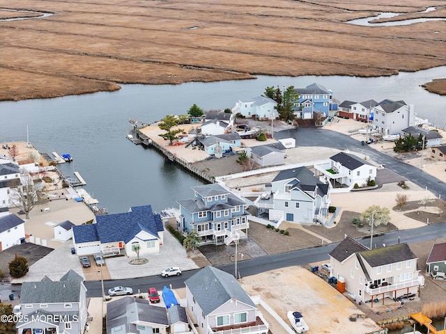 aerial view of residential area with a nearby body of water