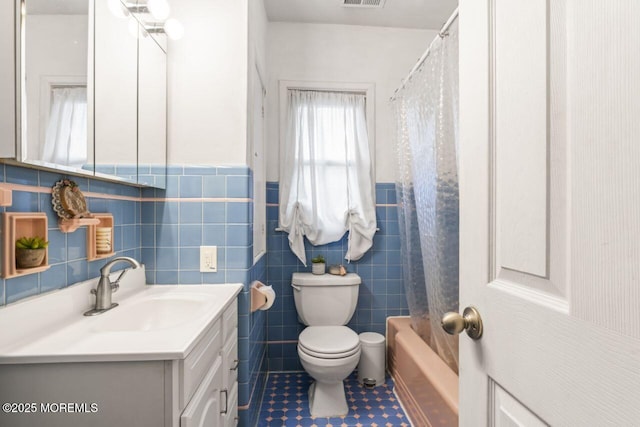 725 Province Line Rd, Allentown, NJ 08501 - full bath with tile patterned floors, vanity, toilet, tile walls, and a wainscoted wall