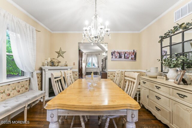 725 Province Line Rd, Allentown, NJ 08501 - dining space with healthy amount of natural light, a chandelier, dark wood-style flooring, and crown molding