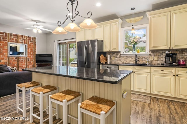 725 Province Line Rd, Allentown, NJ 08501 - kitchen with cream cabinetry, appliances with stainless steel finishes, open floor plan, wood finished floors, and a sink