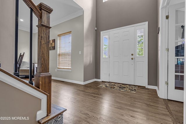 22 Ernest Dr, Lanoka Harbor, NJ 08734 - foyer entrance with wood finished floors, healthy amount of natural light, baseboards, and crown molding