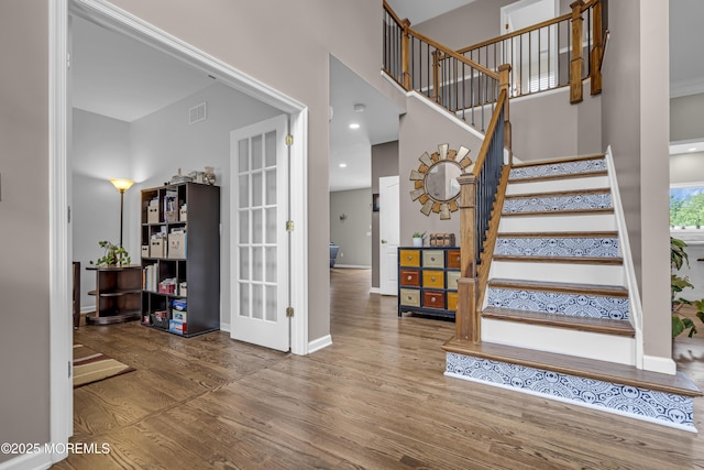 22 Ernest Dr, Lanoka Harbor, NJ 08734 - staircase with wood finished floors, french doors, baseboards, and a towering ceiling