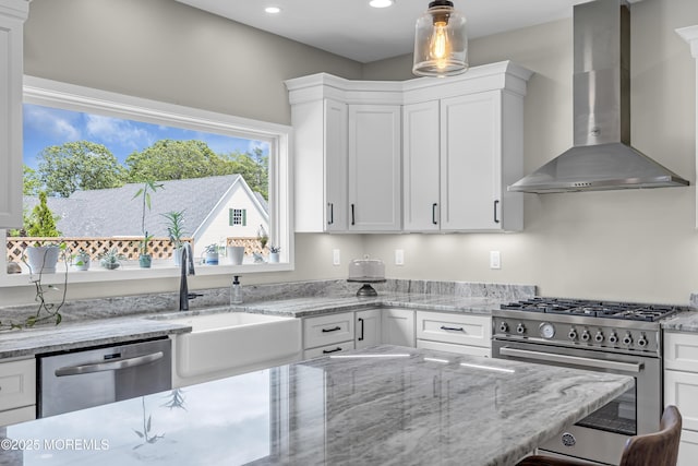 22 Ernest Dr, Lanoka Harbor, NJ 08734 - kitchen featuring wall chimney exhaust hood, stainless steel appliances, white cabinetry, a sink, and recessed lighting