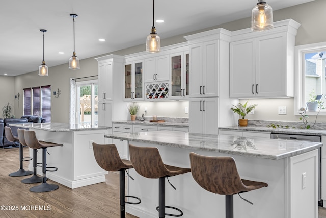 22 Ernest Dr, Lanoka Harbor, NJ 08734 - kitchen with a kitchen island, white cabinets, a breakfast bar, light wood finished floors, and recessed lighting