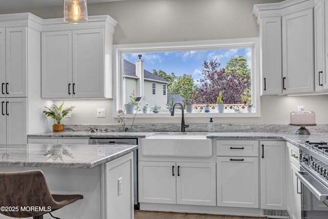 22 Ernest Dr, Lanoka Harbor, NJ 08734 - kitchen with a sink, white cabinets, high end range, and light stone counters