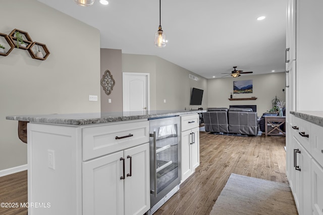 22 Ernest Dr, Lanoka Harbor, NJ 08734 - kitchen featuring wine cooler, ceiling fan, light wood finished floors, recessed lighting, and white cabinets