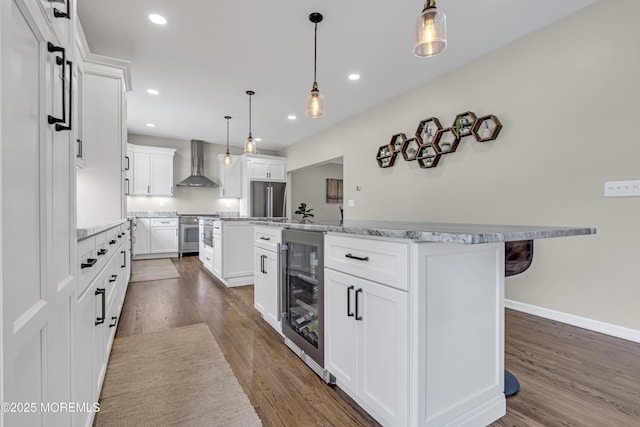 22 Ernest Dr, Lanoka Harbor, NJ 08734 - kitchen featuring wall chimney range hood, a center island, wine cooler, stainless steel range, and dark wood-style flooring