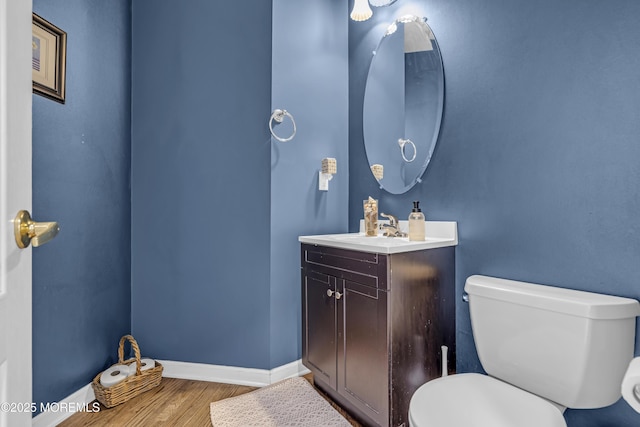 22 Ernest Dr, Lanoka Harbor, NJ 08734 - bathroom with wood finished floors, baseboards, toilet, and vanity