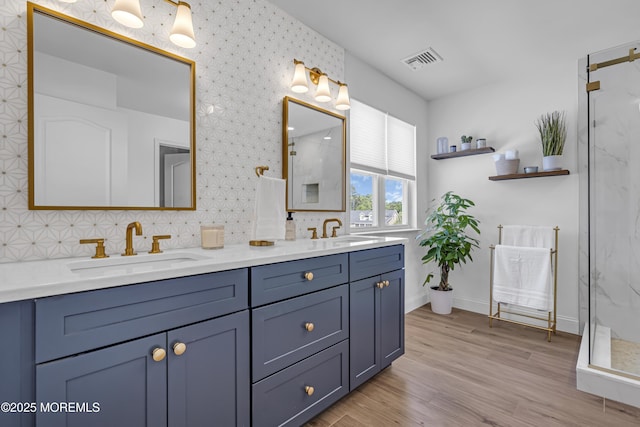 22 Ernest Dr, Lanoka Harbor, NJ 08734 - bathroom featuring a stall shower, backsplash, wood finished floors, baseboards, and double vanity