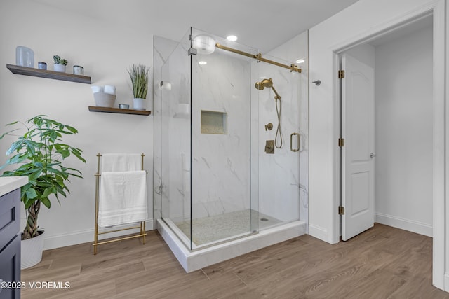 22 Ernest Dr, Lanoka Harbor, NJ 08734 - bathroom featuring vanity, wood finished floors, a marble finish shower, baseboards, and radiator heating unit