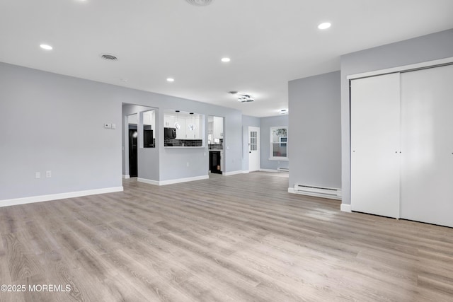 4B Greenwood Ln, Whiting, NJ 08759 - unfurnished living room with a baseboard radiator, light wood finished floors, recessed lighting, and baseboards