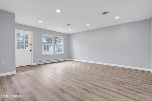 4B Greenwood Ln, Whiting, NJ 08759 - unfurnished living room with baseboard heating, wood finished floors, baseboards, and recessed lighting