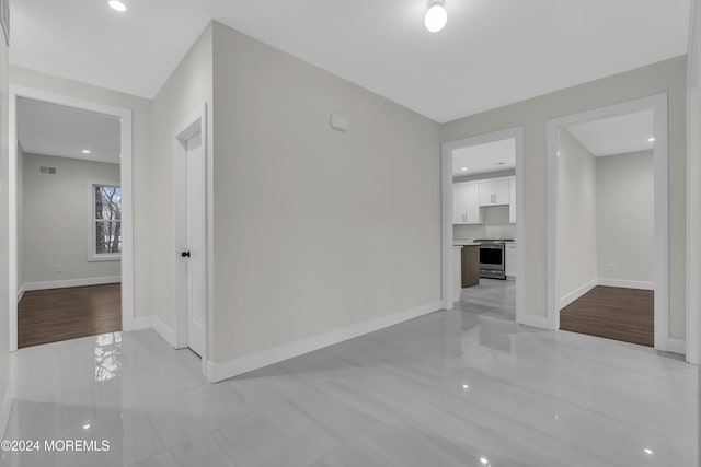 24 Golders Green Rd, Lakewood, NJ 08701 - hall with baseboards and recessed lighting
